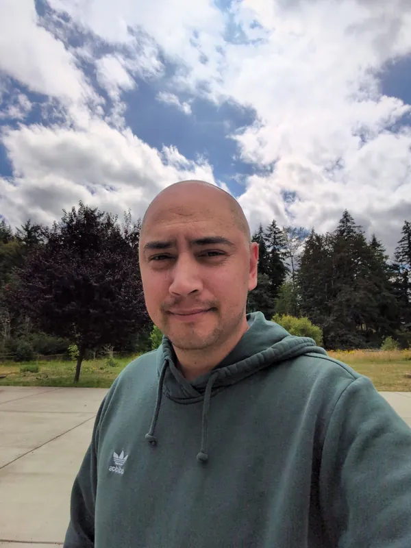 Allen Wood, founder of Kala Phone, outdoors under an open sky.